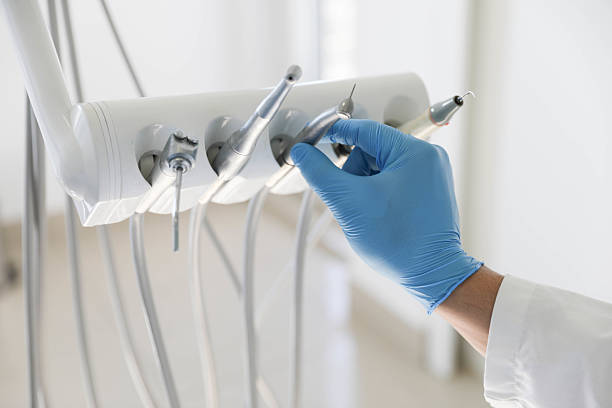 Professional Tooth Extraction technician working in Pensacola, FL